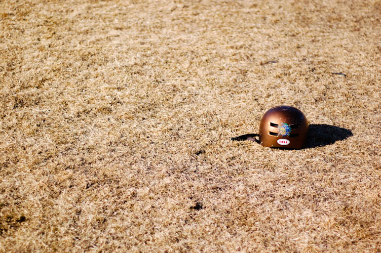 The sun, slowly moving across the surface of a recently abandoned helmet